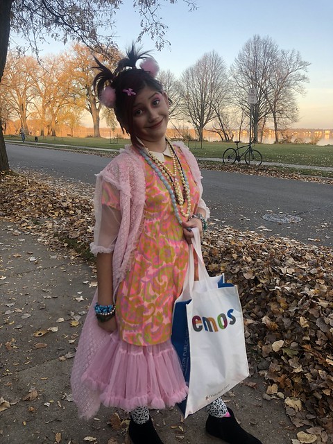Zoe dressed up as Cindy Lauper for Halloween and standing in our traditional photo spot for halloween