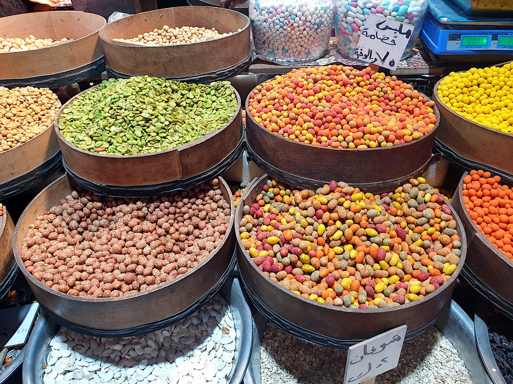 A spread of cheap dishes on a table with QR coins