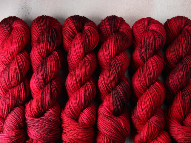 Dynamite DK pure British wool hand dyed yarn 100g – ‘Dahlia’ (deep reds)