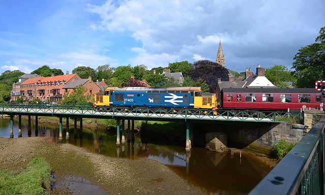 37403 'Isle of Mull' crosses the River Esk at Ruswarp,  on 1T11, 10.00 Whitby - Pickering service. This is the first of nine bridges over the Esk on the route to Grosmont. North Yorkshire Moors Railway. 02 06 2022