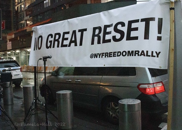 PROTEST outside NY Times DealBook Summit