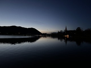 Sunset over the lake and the town Schliersee, Bavaria, Germany, November 2022