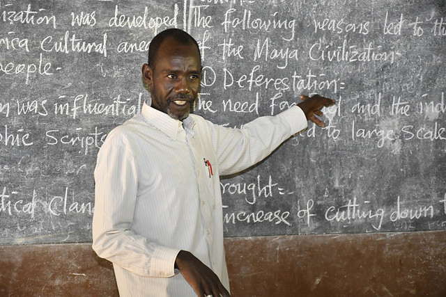 A teacher at the blackboard