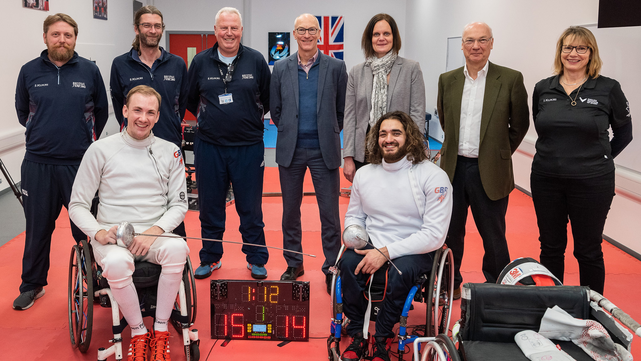 (Front) Piers Gilliver and Dimitri Coutya are joined by their coaches plus representatives from the University of Bath and the EIS at the opening of the new Wheelchair Fencing National Training Centre
