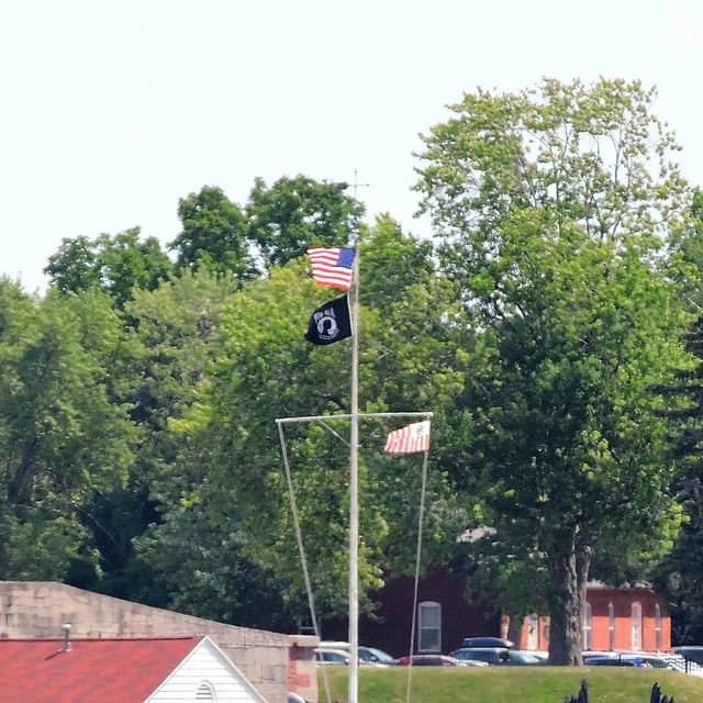American, POW/MIA and U.S. Coast Guard Ensign flags