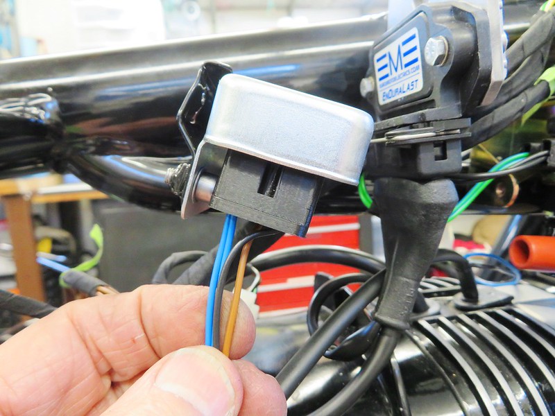 Triangular Plug With BLACK, BROWN & BLUE Wires Install In Bottom Of Voltage Regulator