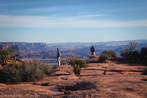 Walking toward the edge of the canyon on the Gooseberry Trail, Island in the Sky, Canyonlands National Park, Utah