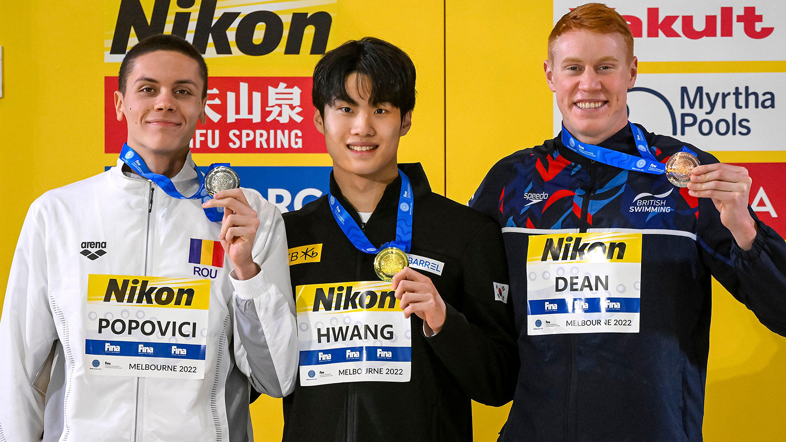 Tom Dean (right) with his fellow 200m freestyle medallists. CREDIT: Insidefoto di Andrea Staccioli/Alamy Live News