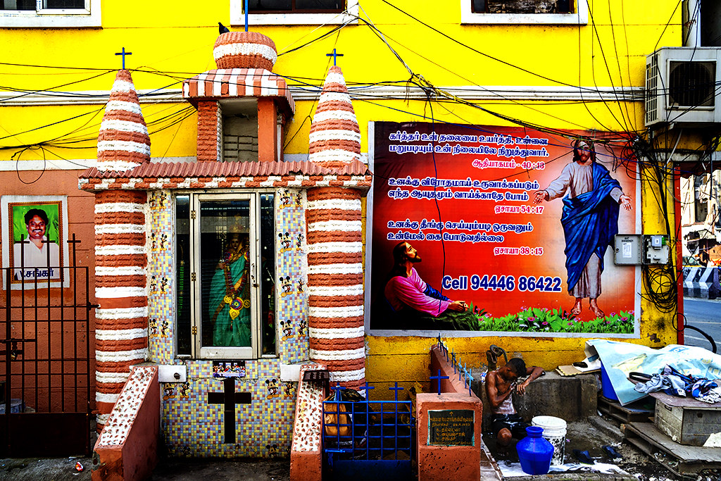 Young man bathing next to Catholic shrine on 12-19-22--Chennai copy