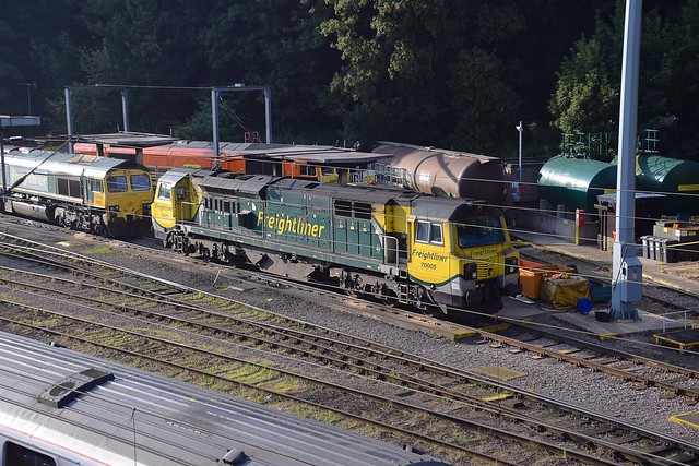 Fuel line at Ipswich sees 70005 & 66542, with orange liveried 66415 behind. 08 09 2019