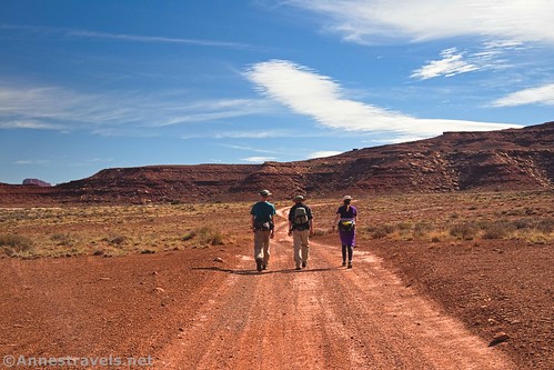 Three hikers on the White Rim Road, Canyonlands National Park, Utah
