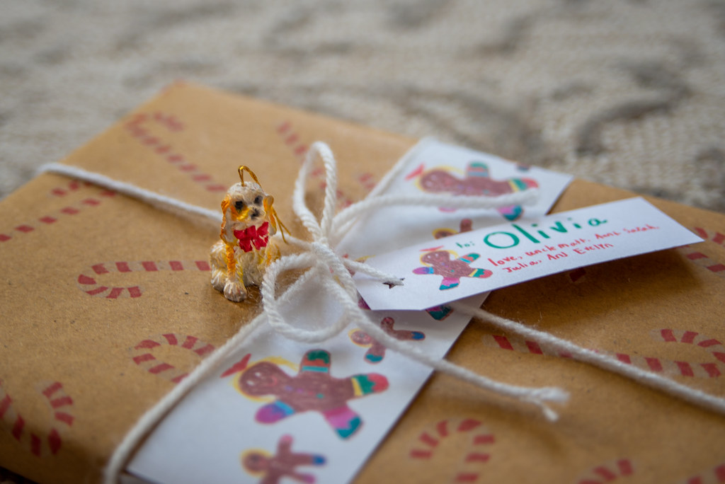 Cute tiny dog ornament as Christmas wrapping flair
