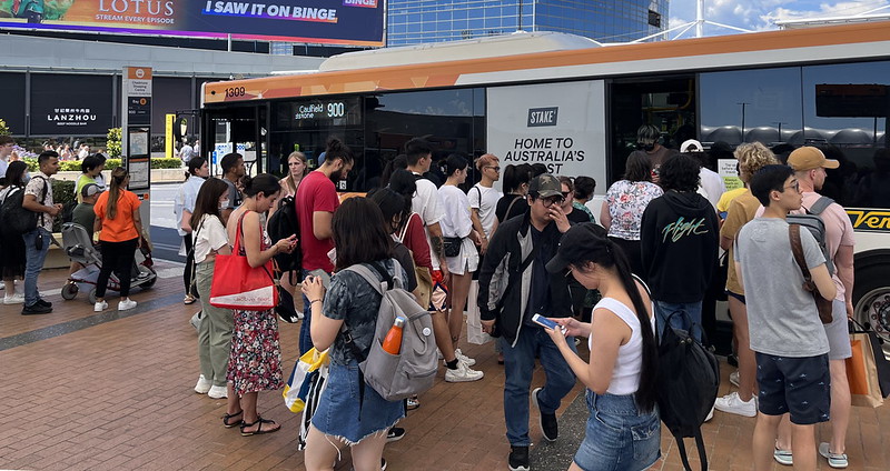 Crowds board a route 900 bus at Chadstone on Boxing Day 2022