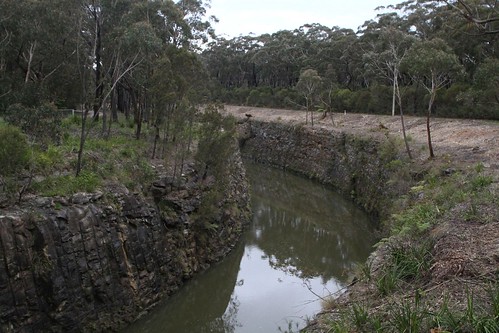 Fitzroy Canal hewn through rock beneath Nowra Road at Fitzroy Falls