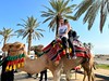 Charlotte and Jenna on a camel