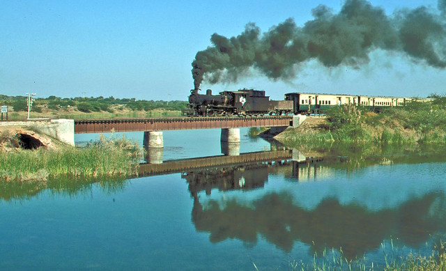 SP 4-6-0 No 140 crossing a canal between  Kachelo and Digri