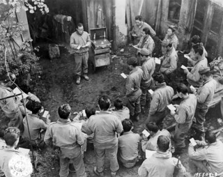 SC 195508-S - Japanese-American infantrymen attend church services outside their billet in France. 24 October, 1944.