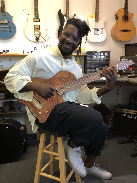The fabulous Tosin Abasi is back for some corrections to his newest guitar. What a great player.