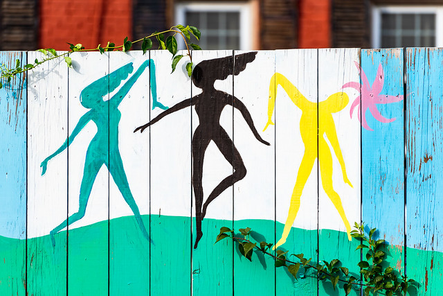 Stylized dancers on street mural