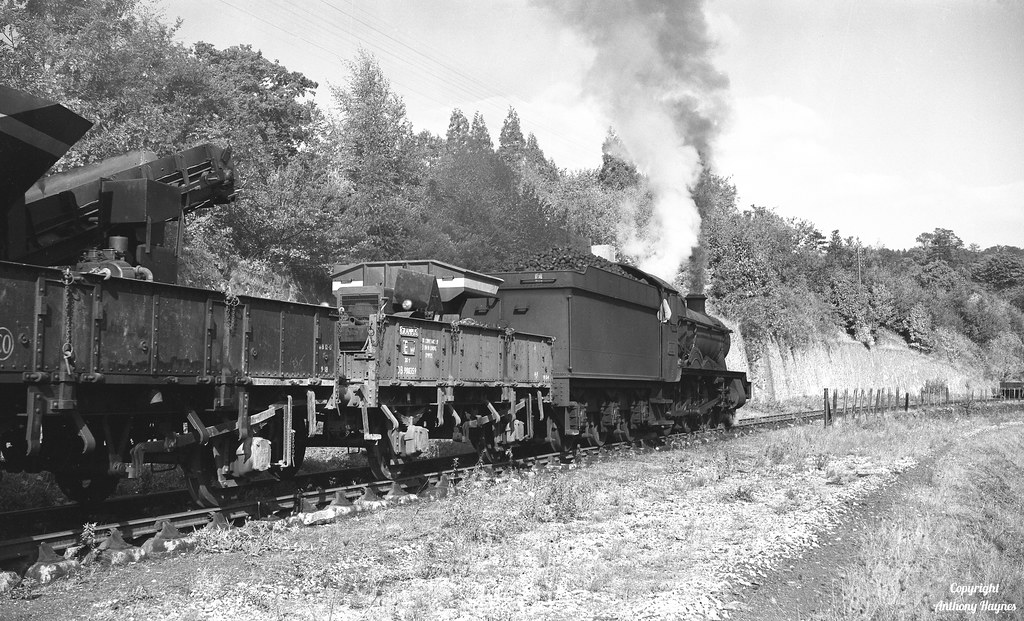 Worcester Sheds Hall Class locomotive No. 4919 'Donnington Hall' shunts a train of civil engineers wagons at Colwall station, Herefordshire.