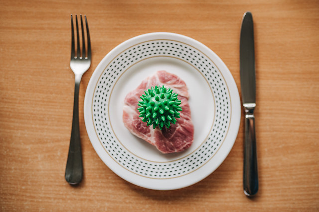 Virus infected meat on a dinner plate
