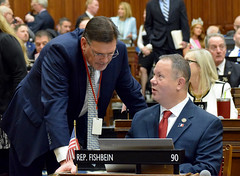 State Rep. Craig Fishbein talks with Rep. O'Dea during the opening day of the 2023 legislative session in the House of Representatives.