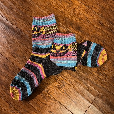 Sandi (sandima) finished this sparkly pair of Grinning Cheshire Cat Socks by Clair Wyvern.
