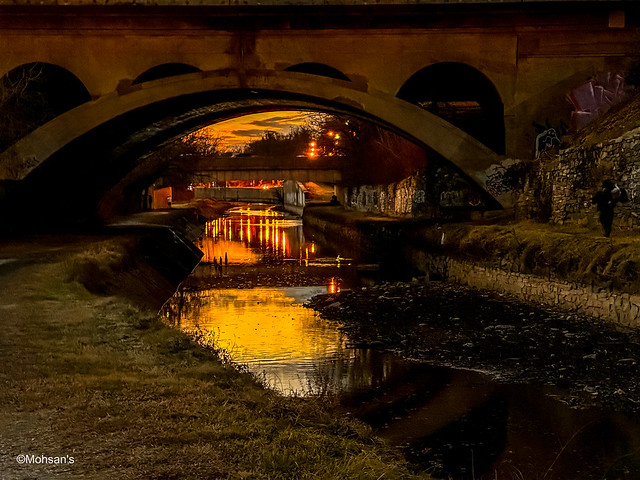 Sunset through a bridge