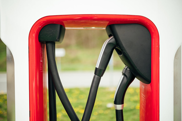 Close-up of charging cables on a Tesla EV charger