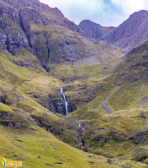 Distant waterfall - along the A82 at the Loch Achtriochtan car park, near Glencoe, Scotland. UK. Europe.