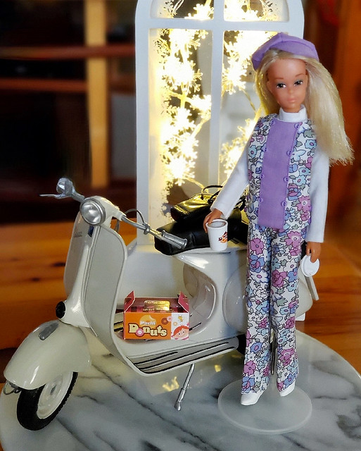 Can't you just see her tooling around town in her adorable outfit, on her darling Vespa?  So much fun!  The donuts and coffee are Rement.