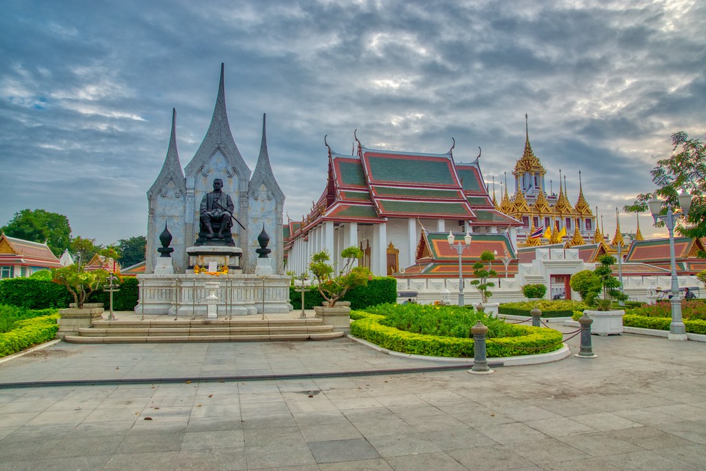 Statue of King Rama III and Wat Ratchanatdaram Worawihan (Loha Prasat) in Bangkok, Thailand