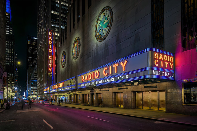 Side view of Radio City Music Hall from a closed off 50th Street in Rockefeller Center, New York City