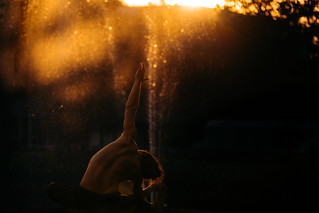 Yogi Stretching At Sunset by Fountain, Chiang Mai, Thailand