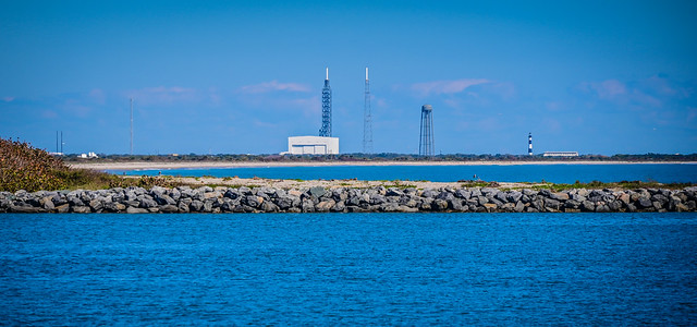 View of Cape Canaveral Space Force Station and Lighthouse from Jetty Park Pier - Port Canaveral FL