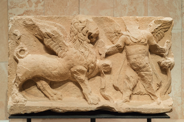 Sandstone relief of an Eros holding two winged lions from Petra