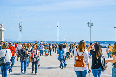 Tourists and Children Casting bubbles into the sky
