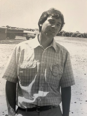 A black and white photo of John Clark in 1984 as resident director of the Fruit Research Station in Clarksville.