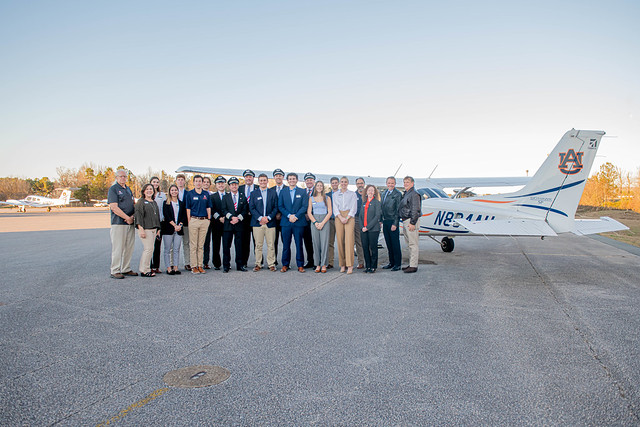 Southwest Airlines captains and staff pose with Auburn Aviation staff and students.
