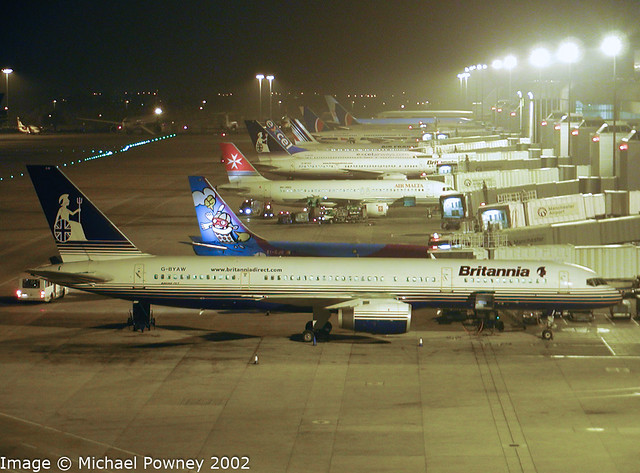 G-BYAW - 1995 build Boeing B757-204, part of the night scene on T2 at Manchester in late 2002