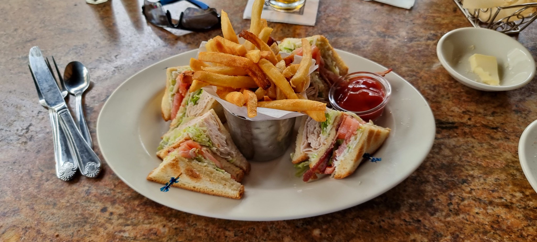 My club sandwich and fries enjoyed at The Cheesecake Factory in Waikiki