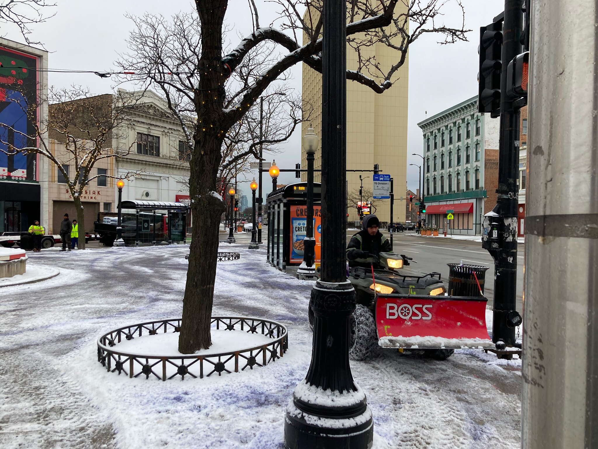 Snowplow clears Polish Triangle plaza.