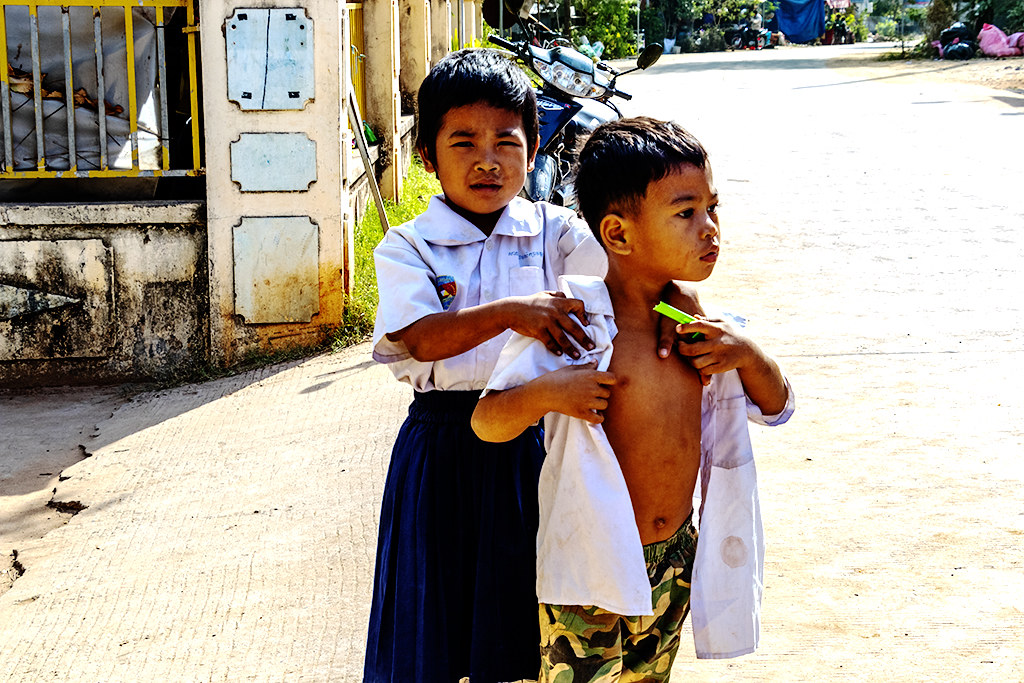 Two childtren playing just outside Phnom Krom Suwon Primary School on 1-31-23--Phnom Krom copy