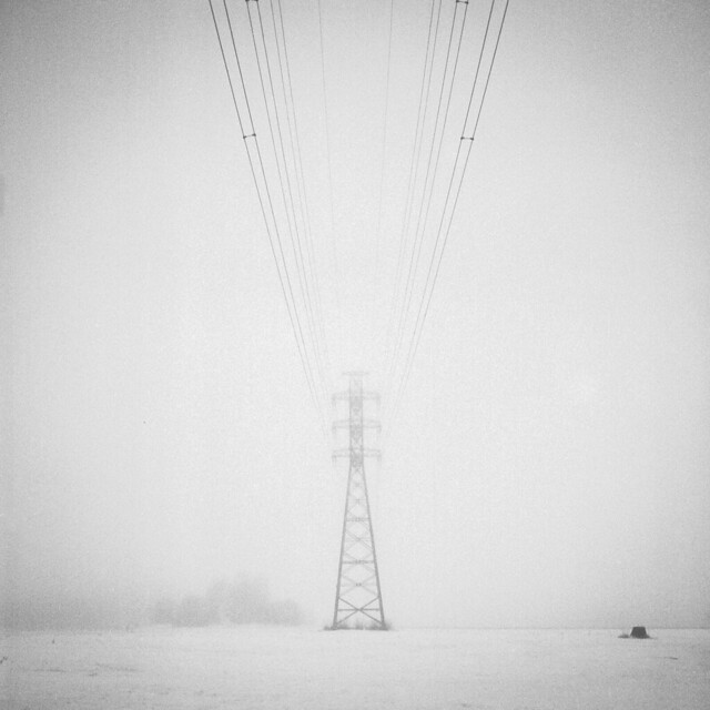 More power lines in foggy weather.