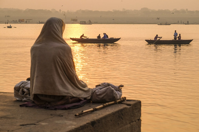 Meditation at sunrise above the Ganges river