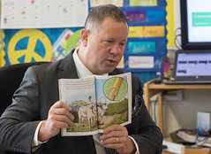 Serving as a guest reader, State Rep. Craig Fishbein reads &quot;The Tuttle Twins and the Miraculous Pencil&quot; by Connor Boyack to 5th grade students at Parker Farms Elementary School in Wallingford.