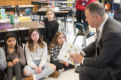 Serving as a guest reader, State Rep. Craig Fishbein reads &quot;The Tuttle Twins and the Miraculous Pencil&quot; by Connor Boyack to 5th grade students at Parker Farms Elementary School in Wallingford.