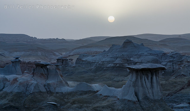 Sun Rises Through Dusty Clouds Over an Alien Landscape, Bisti/De-Na-Zin Wilderness, New Mexico