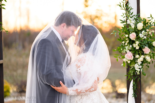 Veil over bride and groom with sunset by Ryan Smith Photography, longs scusa usa