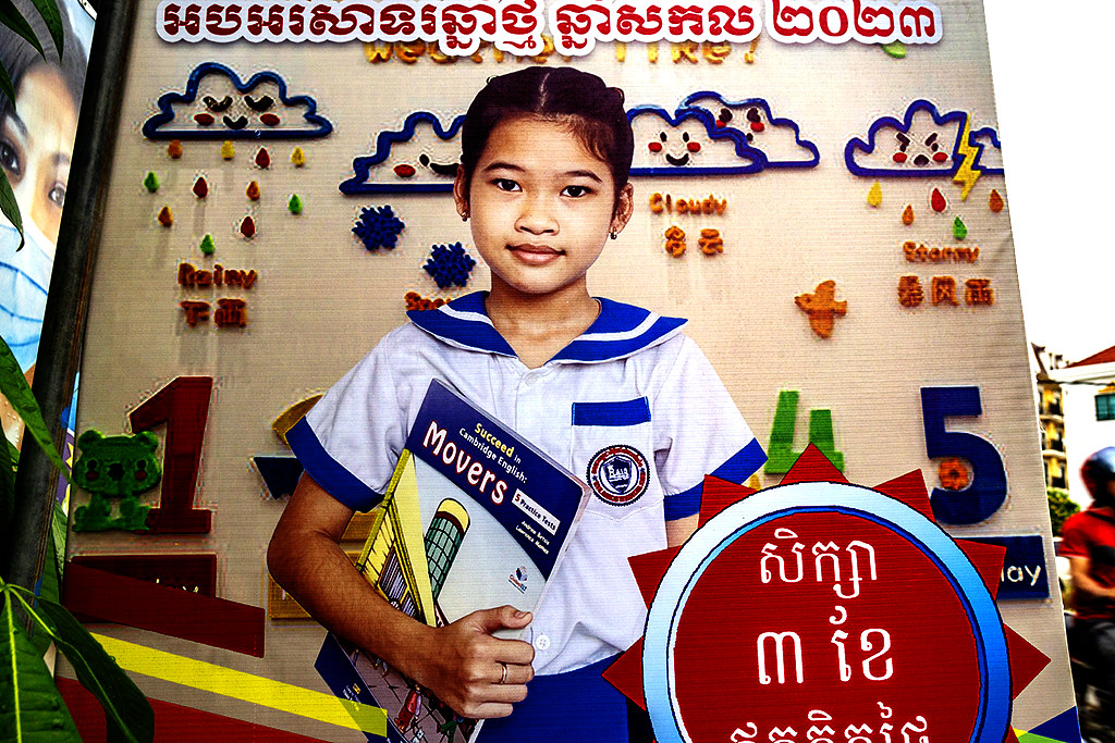 Schoolgirl holding Suceed in Cambridge English book on 2-3-23--Siem Reap copy